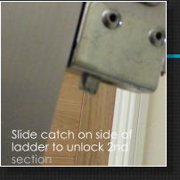Slide catch on side of ladder to unlock 2nd section